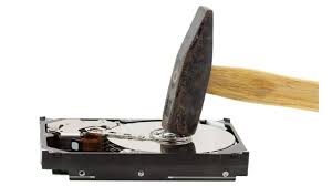 picture of hard drive being hit with hammer